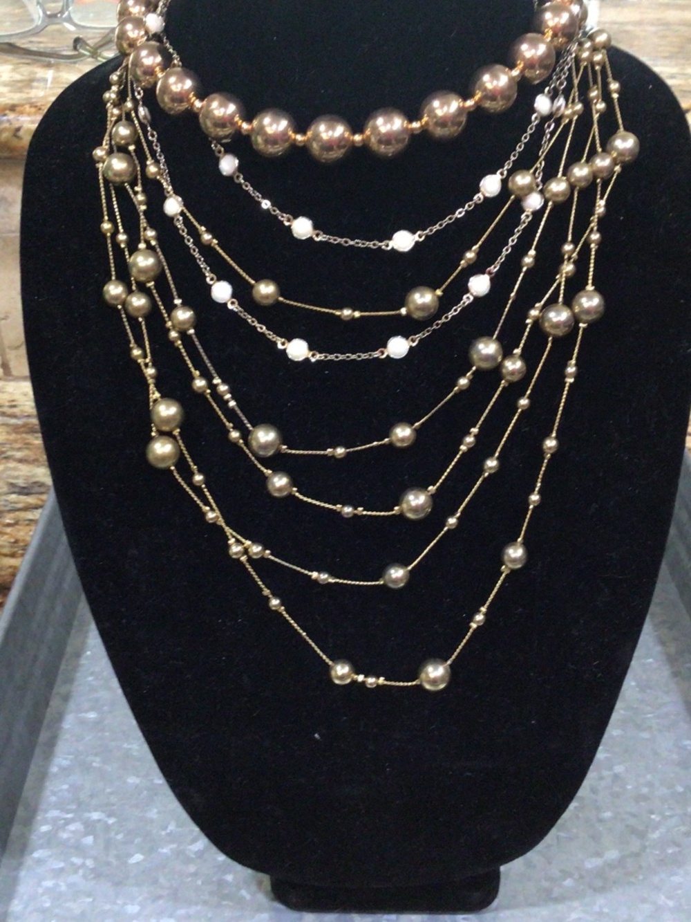 Three gold tone necklaces. All in good shape